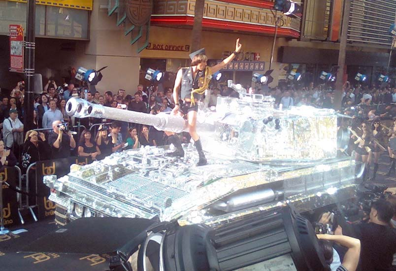Illustration for article titled "Bruno" Straddles Mirrored Tank For Hollywood Premiere